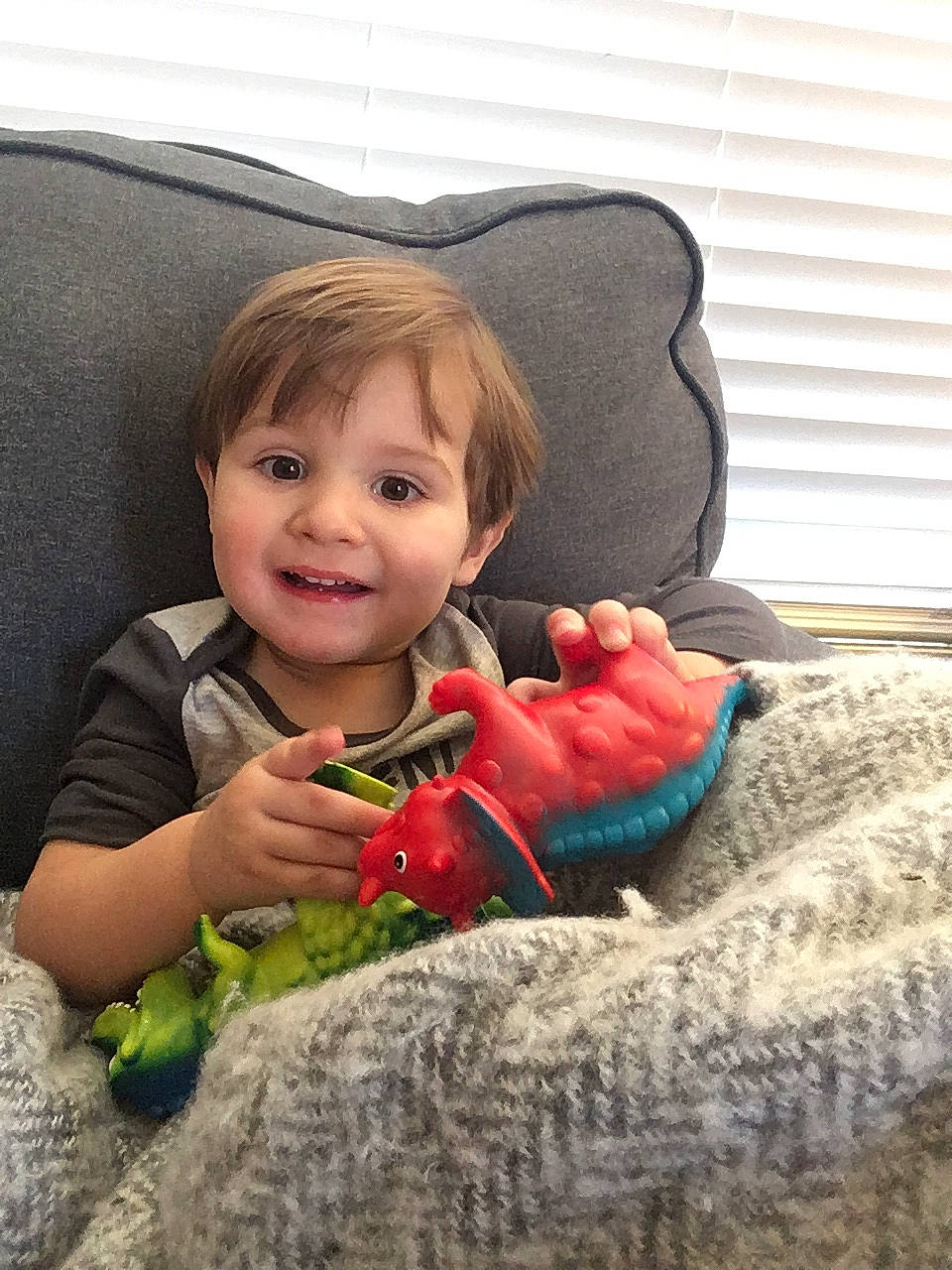 Caspian is registered to the contest to win money with this photo: baby, cheek, child, eye, finger, fun, hand, joy, person, plant, play, sitting, skin, smile, toddler, toy