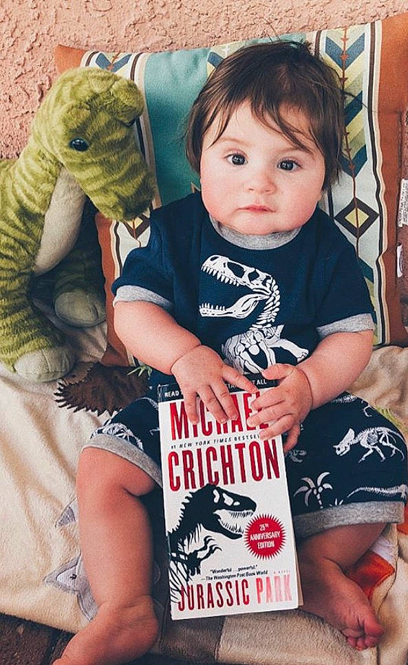 Caspian is registered to the contest to win money with this photo: arm, baby, cheek, child, cool, electronic_device, leg, person, t_shirt, toddler, top, vacation