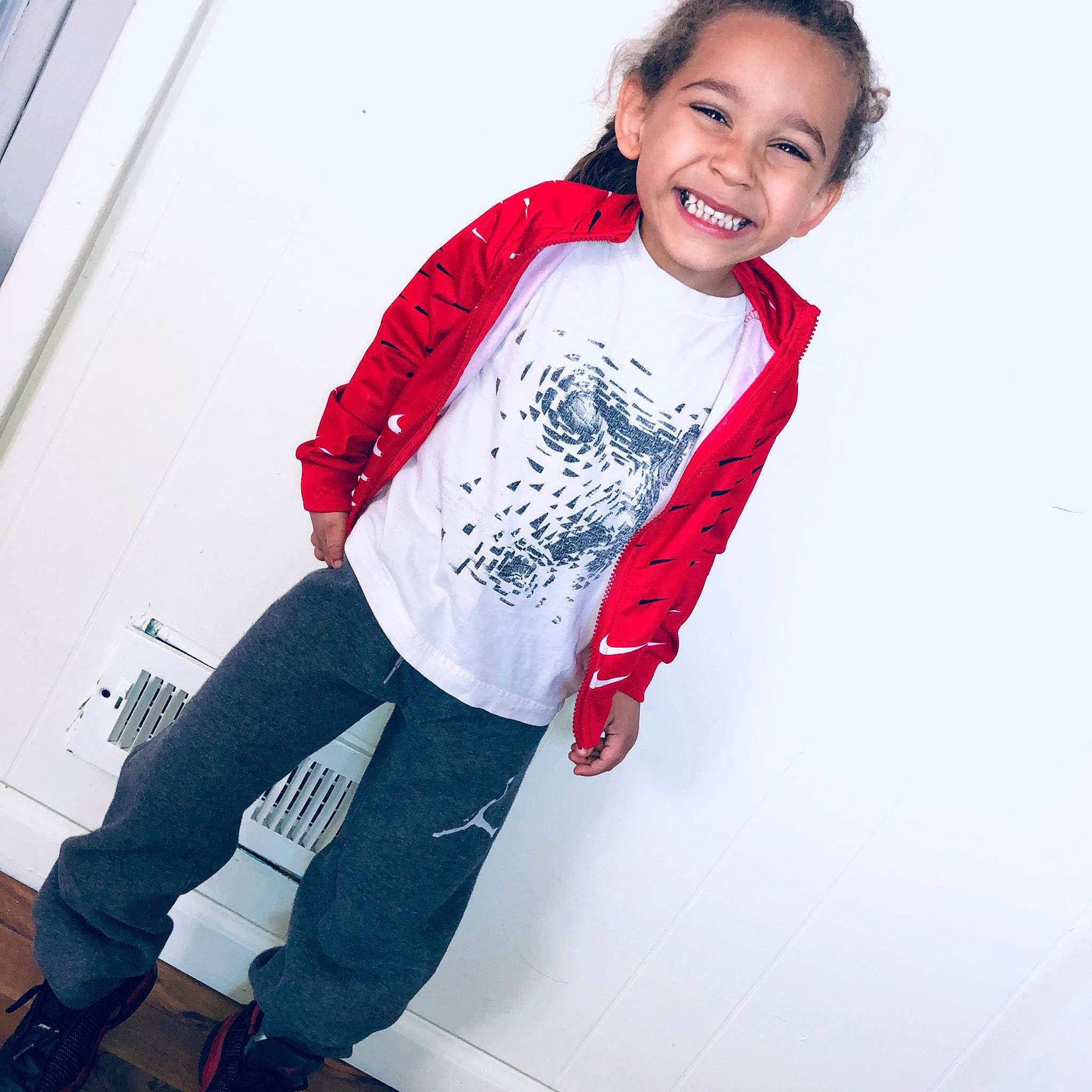 Darius is registered to the contest to win money with this photo: boot, cool, denim, electric_blue, fashion_accessory, fashion_design, flash_photography, happy, human_leg, jersey, joy, knee, magenta, pattern, person, personal_protective_equipment, sleeve, smile, sportswear, street_fashion