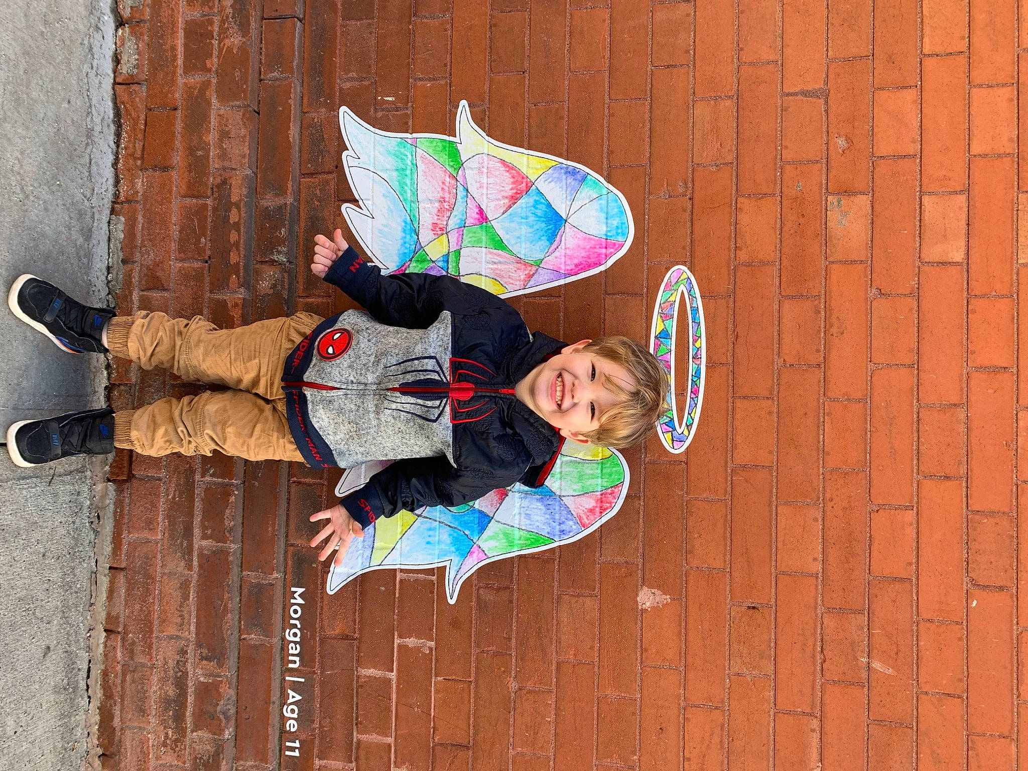 Royal is registered to the contest to win money with this photo: art, brick, brickwork, child, facade, fashion_accessory, fun, happy, joy, leisure, magenta, pattern, person, street, toddler, visual_arts, walking_shoe, window, wood, wood_stain