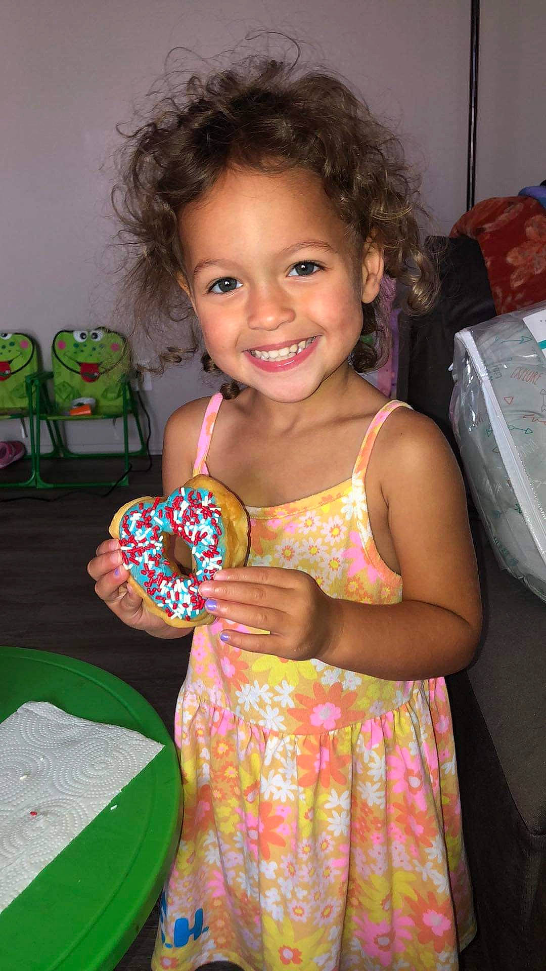 Everleigh is registered to the contest to win money with this photo: beauty, box, chair, child, dress, event, eye, fun, hairstyle, happy, head, joy, magenta, party, pattern, person, pink, play, room, sitting