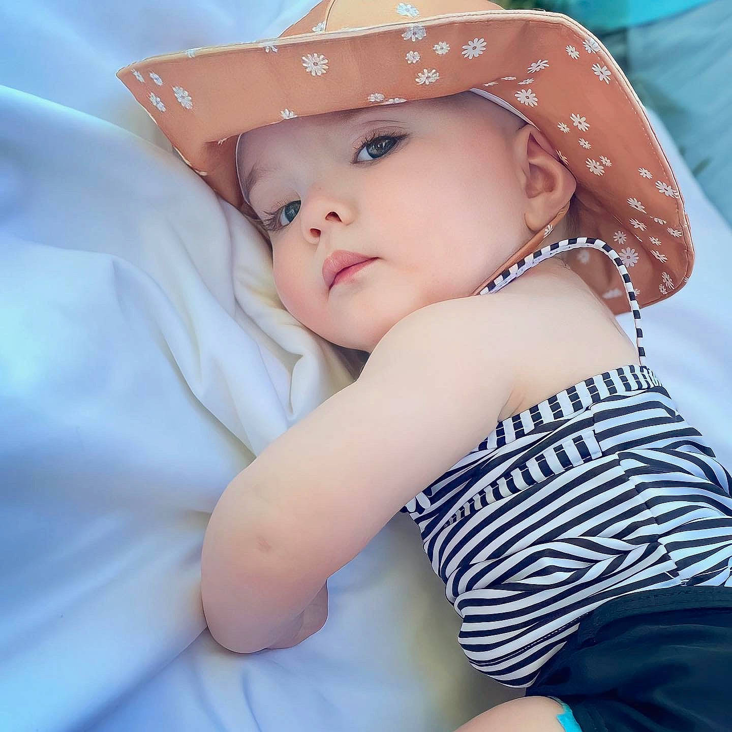 Myra is registered to the contest to win money with this photo: baby, baby_toddler_clothing, blue, cap, child, cool, eye, eyebrow, eyelash, face, flash_photography, hairstyle, happy, hat, headgear, lip, neck, person, skin, sun_hat