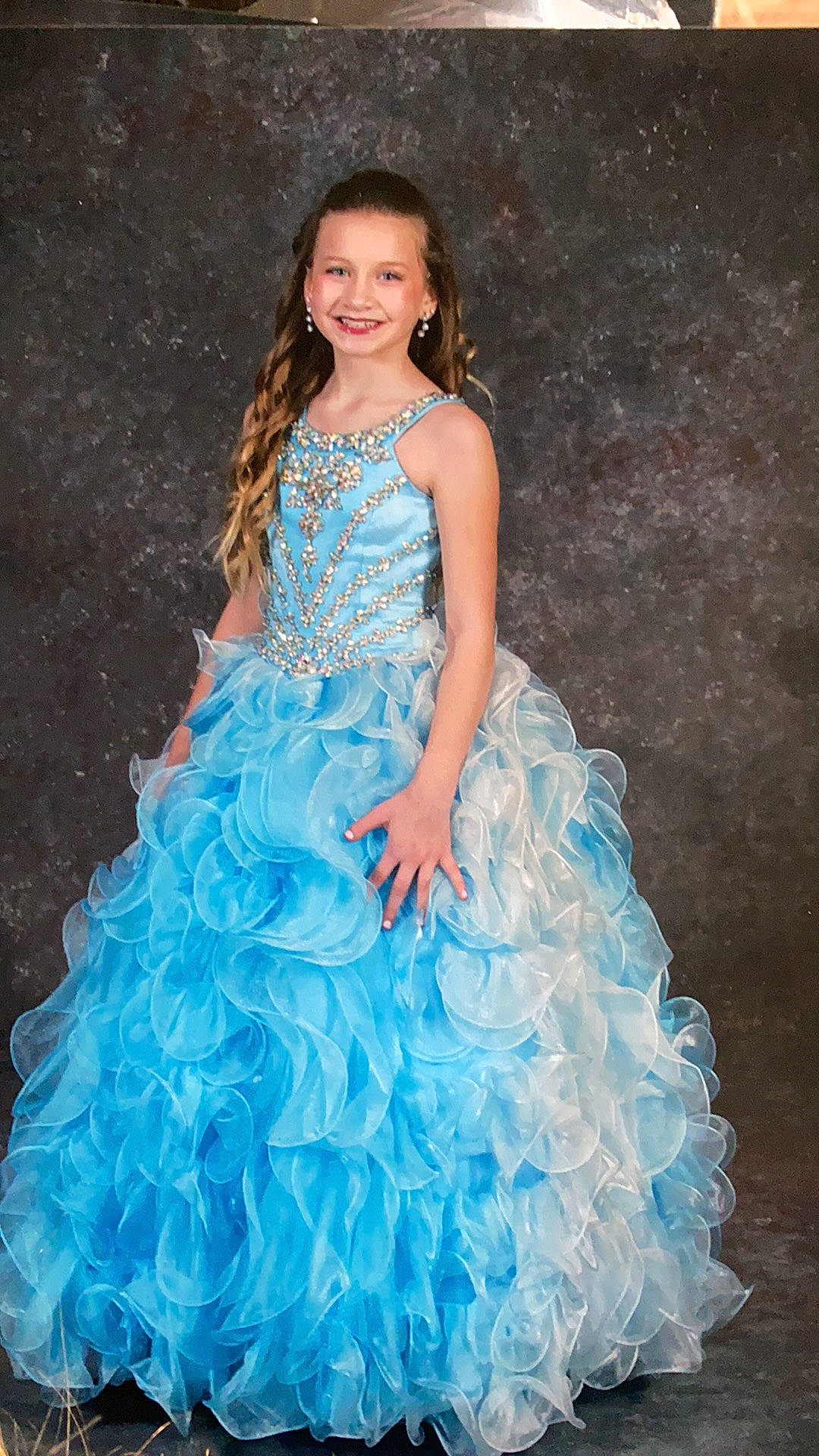 Alyssa is registered to the contest to win money with this photo: aqua, azure, bridal_party_dress, clothing, day_dress, dress, embellishment, fashion_design, flash_photography, gown, hair, head, joy, neck, one_piece_garment, person, ruffle, shoulder, sleeve, smile