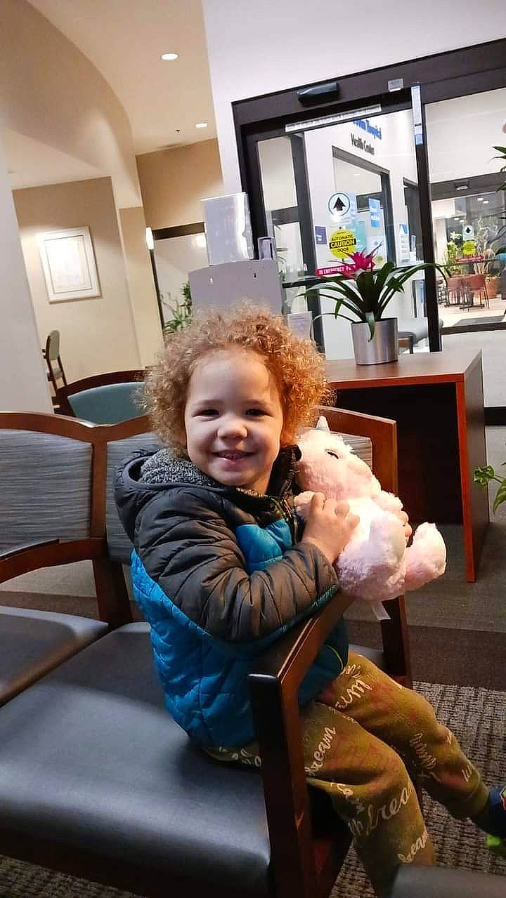 Jazelle is registered to the contest to win money with this photo: chair, comfort, companion_dog, flooring, fun, fur, happy, houseplant, joy, lap, leisure, mammal, person, plant, room, sitting, smile, toddler, toy, toy_dog