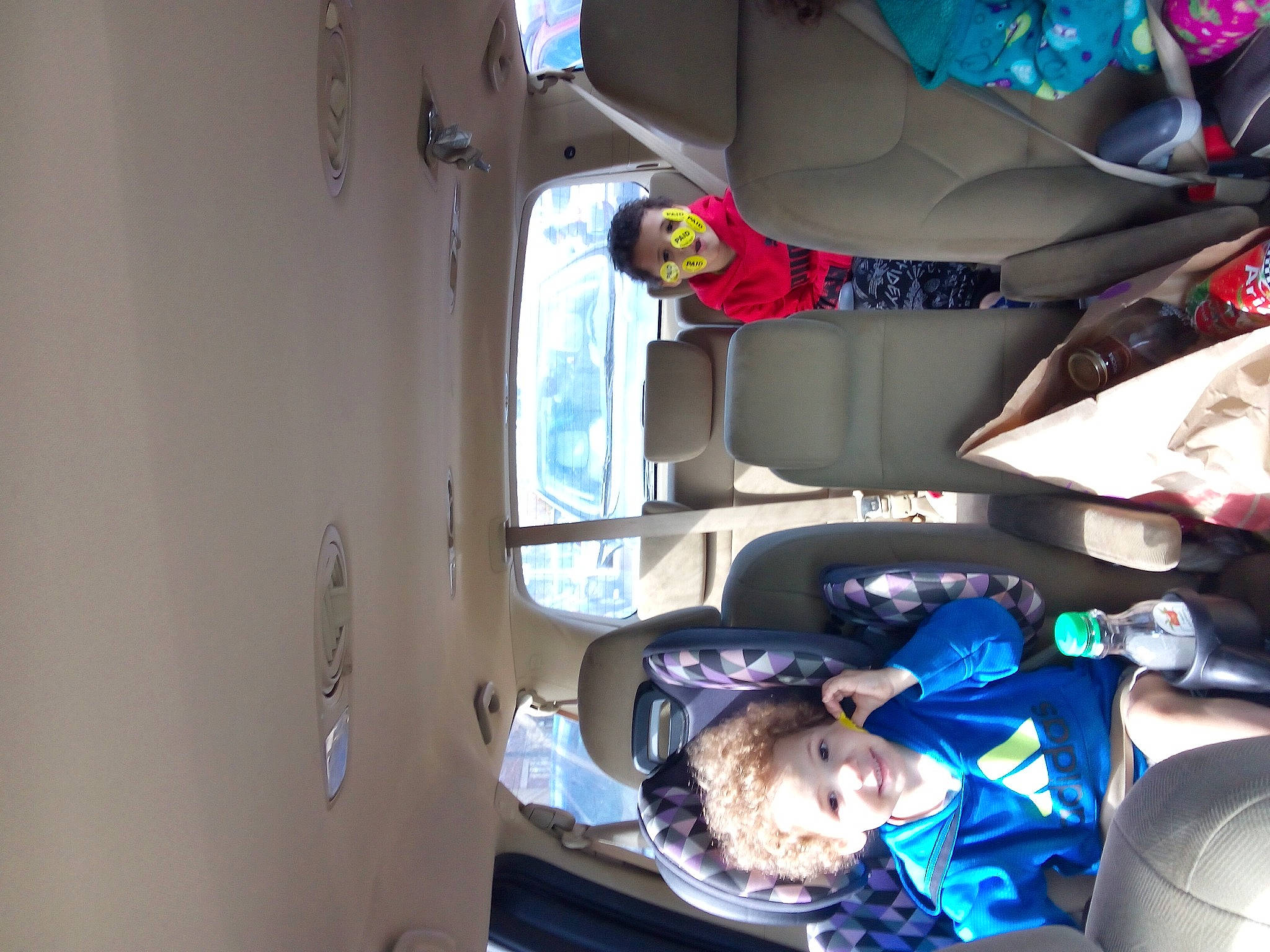 Jazelle is registered to the contest to win money with this photo: auto_part, automotive_design, automotive_exterior, child, comfort, electric_blue, family_car, fun, hat, joy, machine, motor_vehicle, person, room, t_shirt, toddler, trunk, vehicle_door