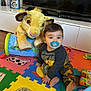 Adrien a rejoint le concours — aidez-le/la à gagner de superbes lots ! baby, pacifier, plush_toy, simba, lion_king, foam_mat, toy, child, indoor, colorful, floor, television, furniture, playtime, crawling, clothing, cute, living_room, person, foot