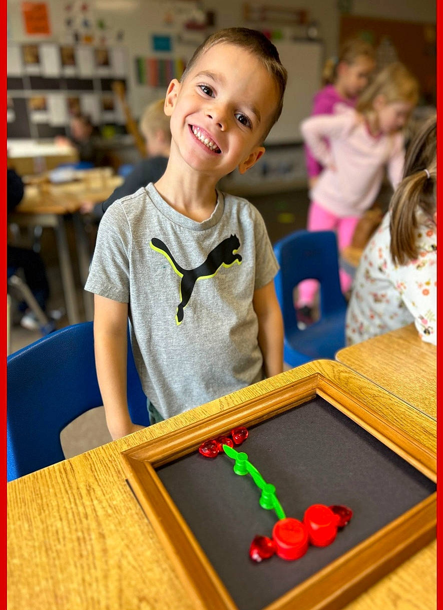 Axel joined the competition — help win amazing prizes! chair, child, event, flooring, fun, happy, indoor_games_and_sports, joy, leisure, person, photograph, play, recreation, recreation_room, room, shelf, smile, t_shirt, table, toddler