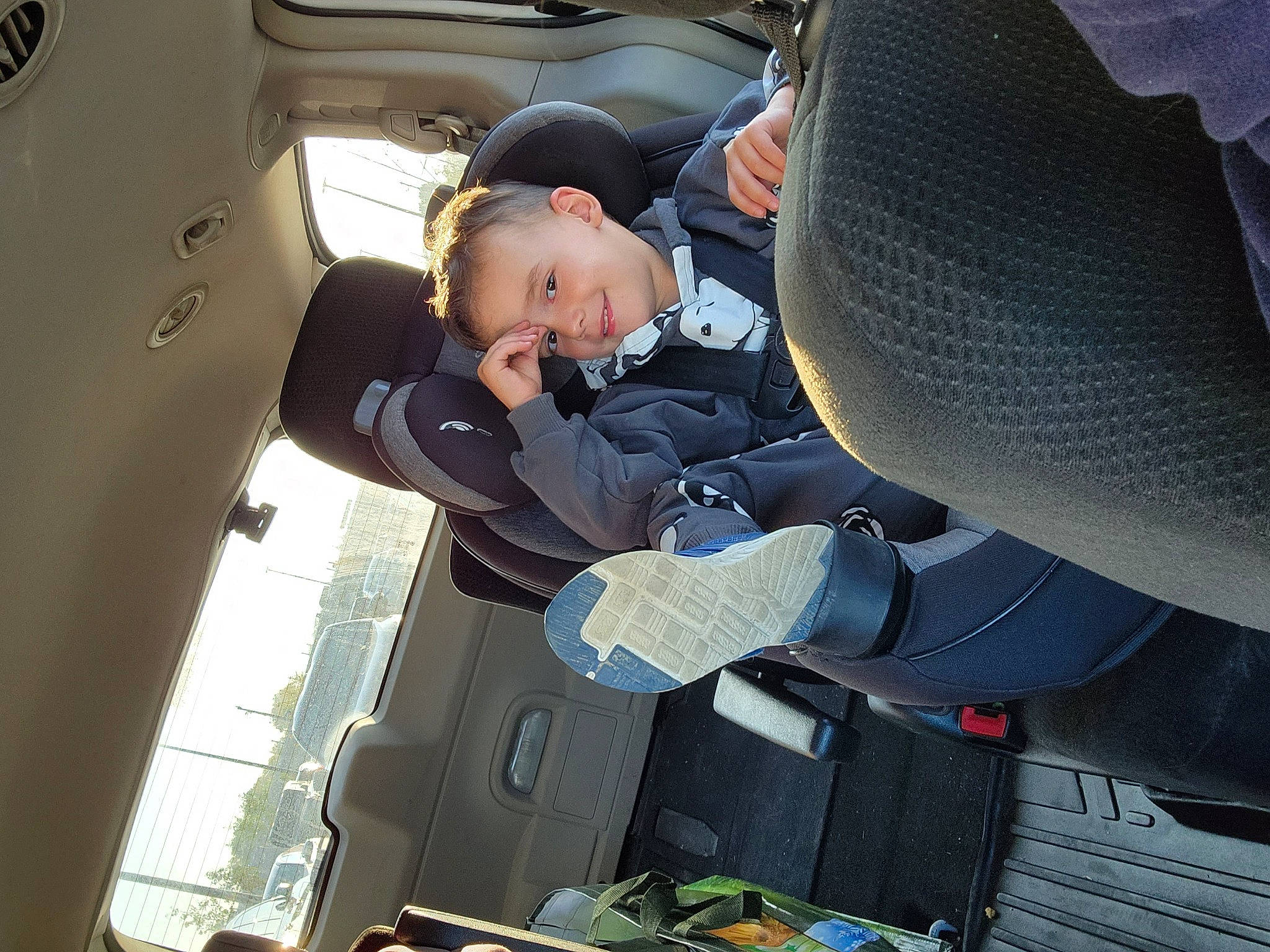 Remington is registered to the contest to win money with this photo: air_travel, auto_part, automotive_design, automotive_exterior, automotive_wheel_system, automotive_window_part, car_seat, car_seat_cover, comfort, family_car, head_restraint, joy, luxury_vehicle, mode_of_transport, motor_vehicle, person, personal_luxury_car, toddler, vehicle, vehicle_door