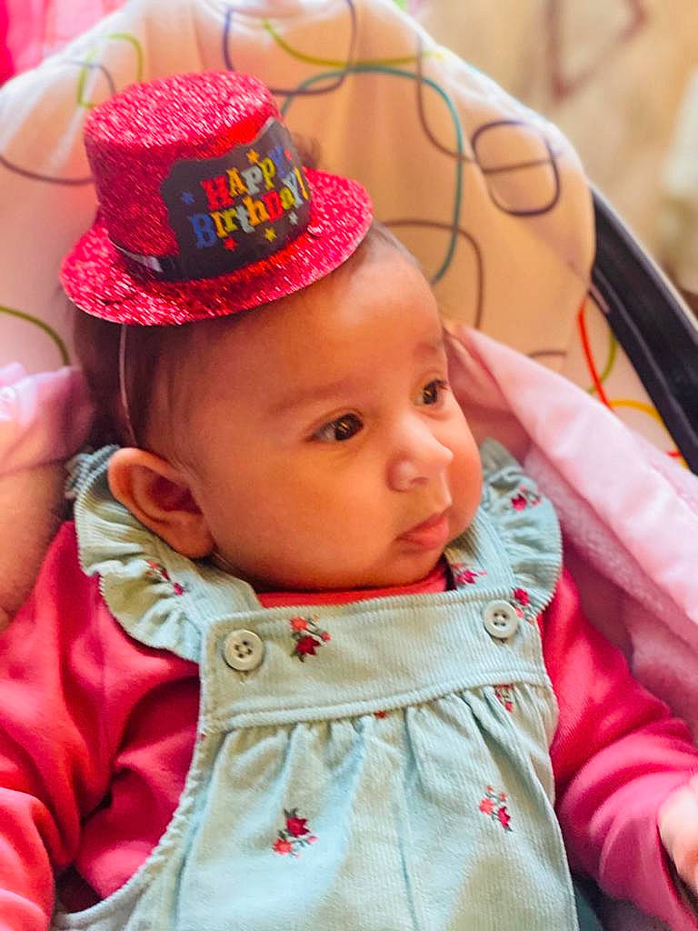 Athaliah is registered to the contest to win money with this photo: baby, cheek, child, fashion_accessory, hat, headgear, headwear, person, pink, skin, sun_hat, toddler