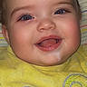apparel, baby, blue_eyes, cheerful, child, closeup, clothing, cute, drool, face, happy, indoors, infant, person, portrait, smiling, striped_background, teddy_bear, yellow_shirt, young