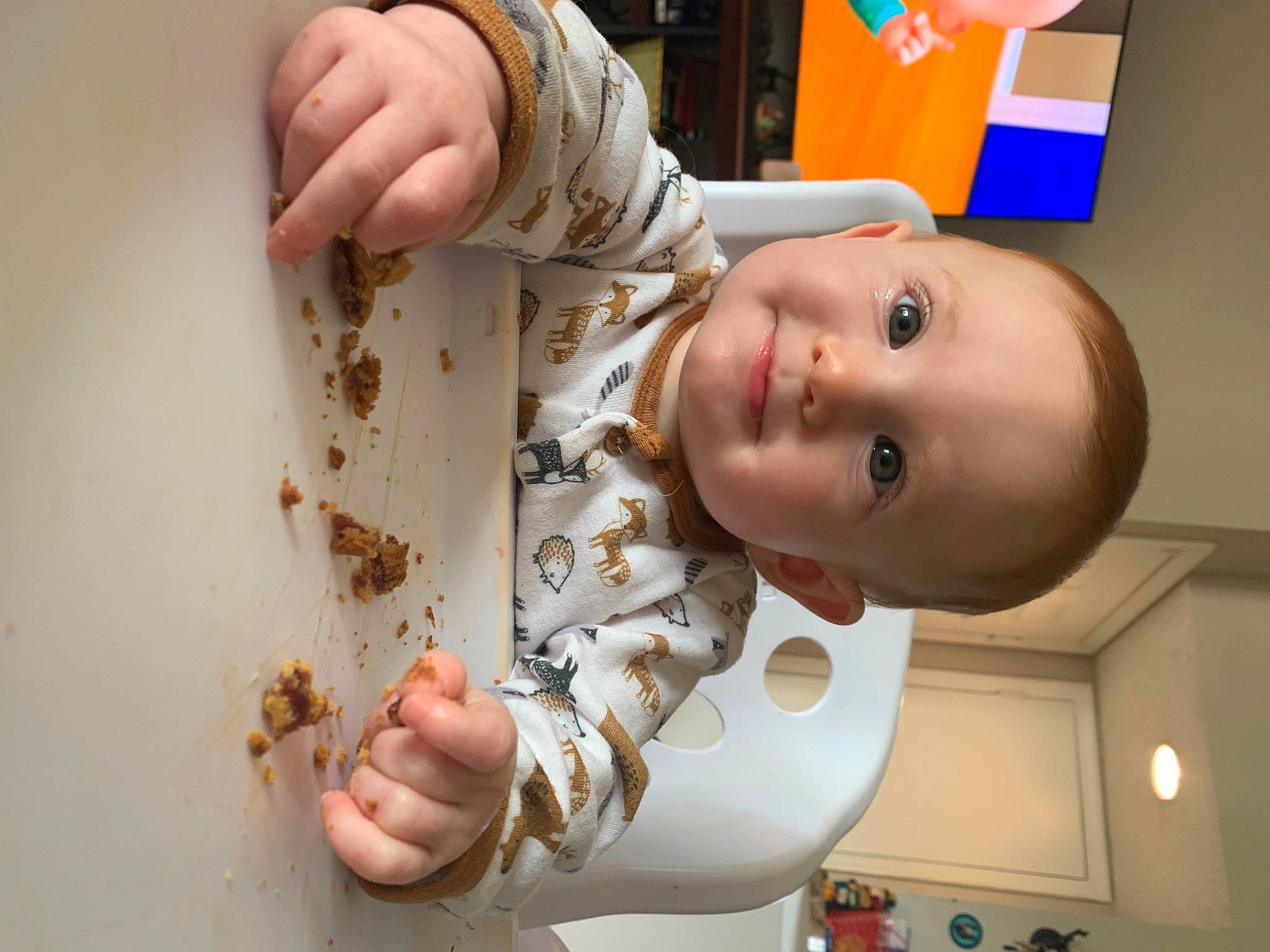 Clementine is registered to the contest to win money with this photo: arm, baby, baby_products, baby_toddler_clothing, cheek, chest, child, comfort_food, elbow, eye, finger, food, fun, hand, happy, joy, nail, person, picture_frame, smile