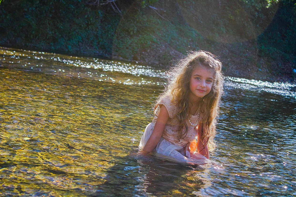 Tessa is registered to the contest to win money with this photo: bank, bathing, black_hair, flash_photography, grass, happy, joy, lake, leisure, long_hair, people_in_nature, person, recreation, stream, sunlight, swimwear, tree, water, water_feature, water_resources