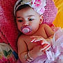 accessories, adorable, baby, bracelets, bunny_ears, child, colorful, cute, floral_blanket, flower_headband, hands, indoors, infant, pacifier, pink_cushion, portrait, resting, soft_texture, tutu_skirt, young