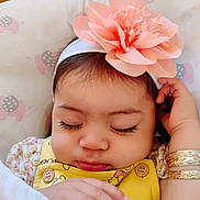 Penelope joined the competition — help win amazing prizes! baby, sleeping, headband, flower, yellow_outfit, blanket, elephant_pattern, long_eyelashes, hand, bracelet, cute, child, infant, soft_texture, closeup, peaceful, indoors, portrait, rest, cozy