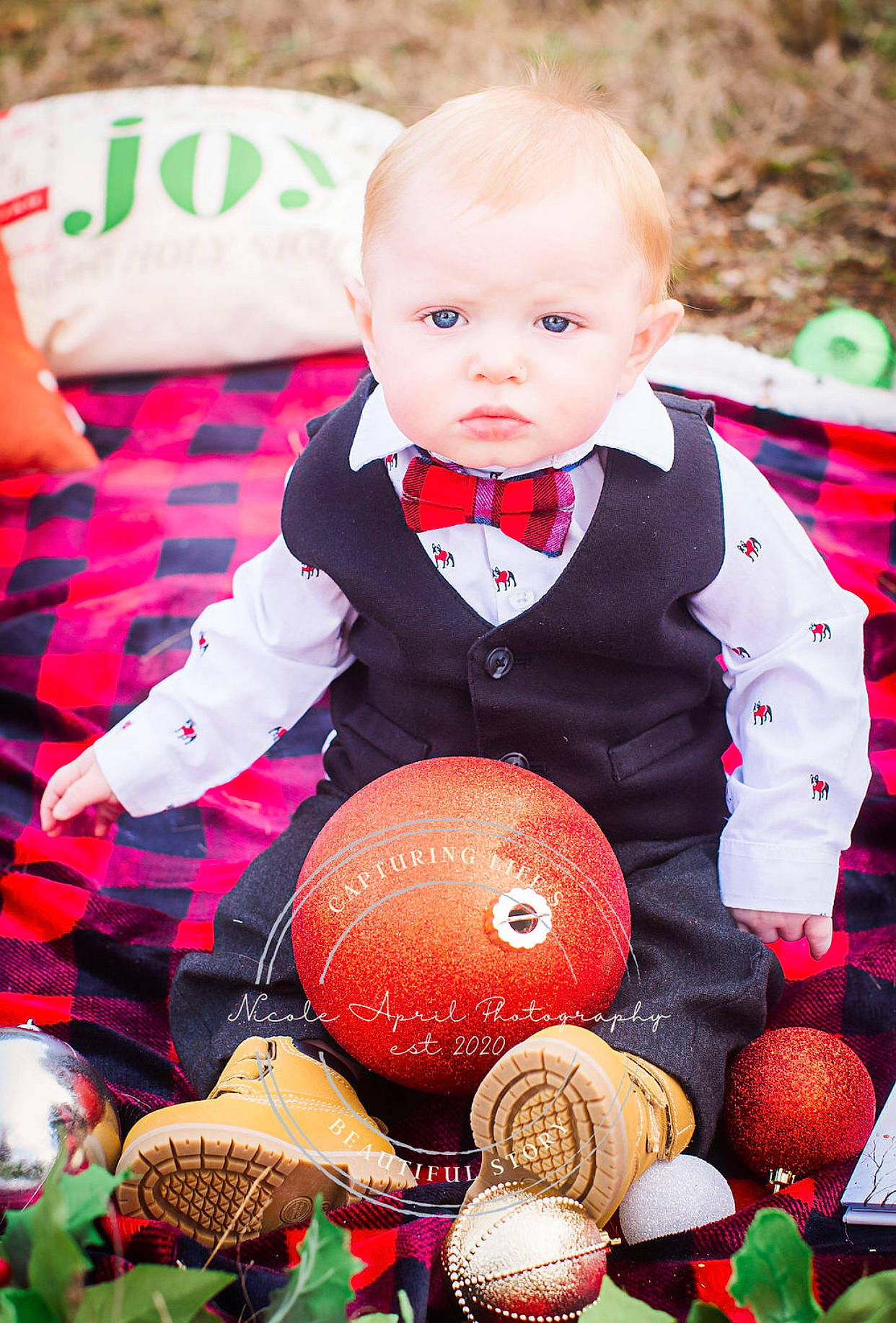 Avery joined the competition — help win amazing prizes! baby, baby_toddler_clothing, child, christmas_decoration, christmas_ornament, dress, event, formal_wear, grass, happy, holiday, pattern, people_in_nature, person, plaid, plant, red, sitting, textile, toddler