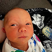 Ezra joined the competition — help win amazing prizes! baby, babycare, blanket, bottle, closeup, clothing, cute, eyes, face, feeding, head, indoors, infant, newborn, person, portrait, resting, skin, swaddled, young