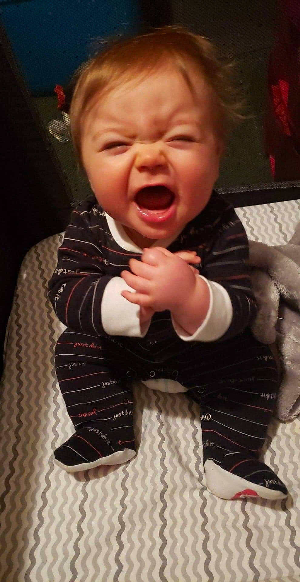 Kingston is registered to the contest to win money with this photo: arm, baby, baby_toddler_clothing, cheek, child, comfort, computer_keyboard, gesture, hand, happy, lip, mouth, nose, pattern, person, shout, skin, sleeve, textile, thumb