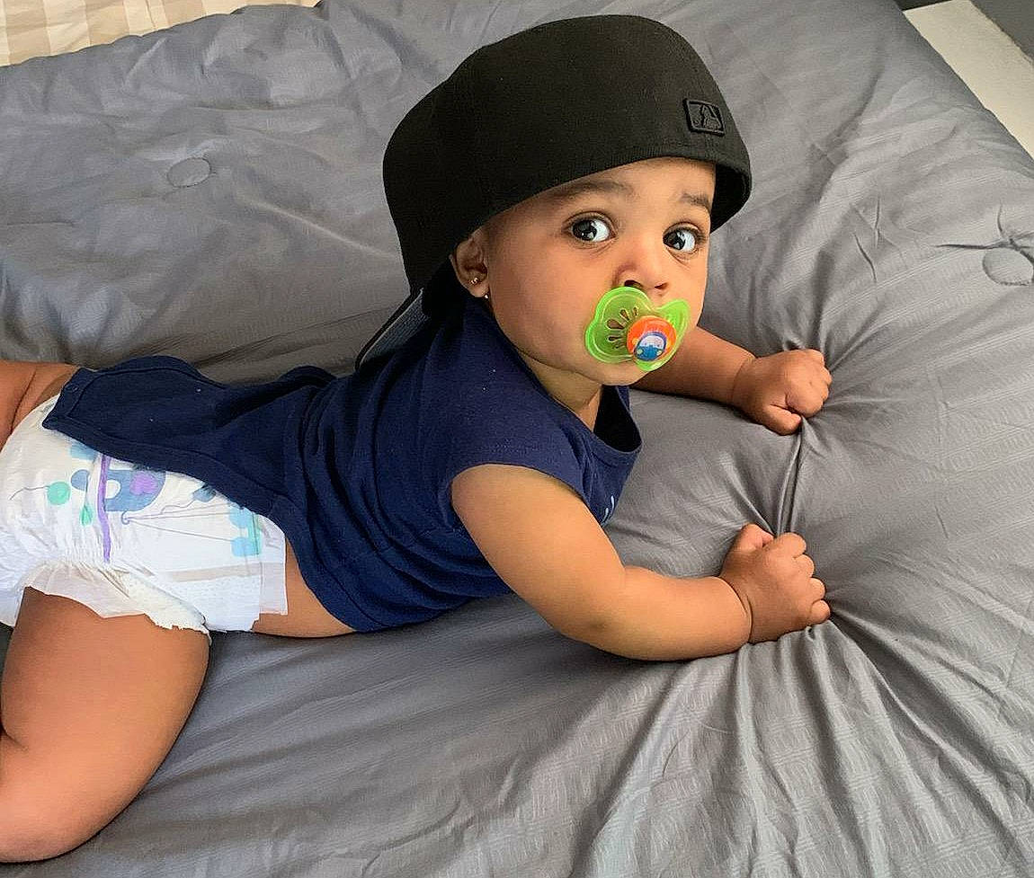Dallas joined the competition — help win amazing prizes! baby, black_hair, cap, child, headgear, headwear, leg, nose, person, photography, play, t_shirt, toddler