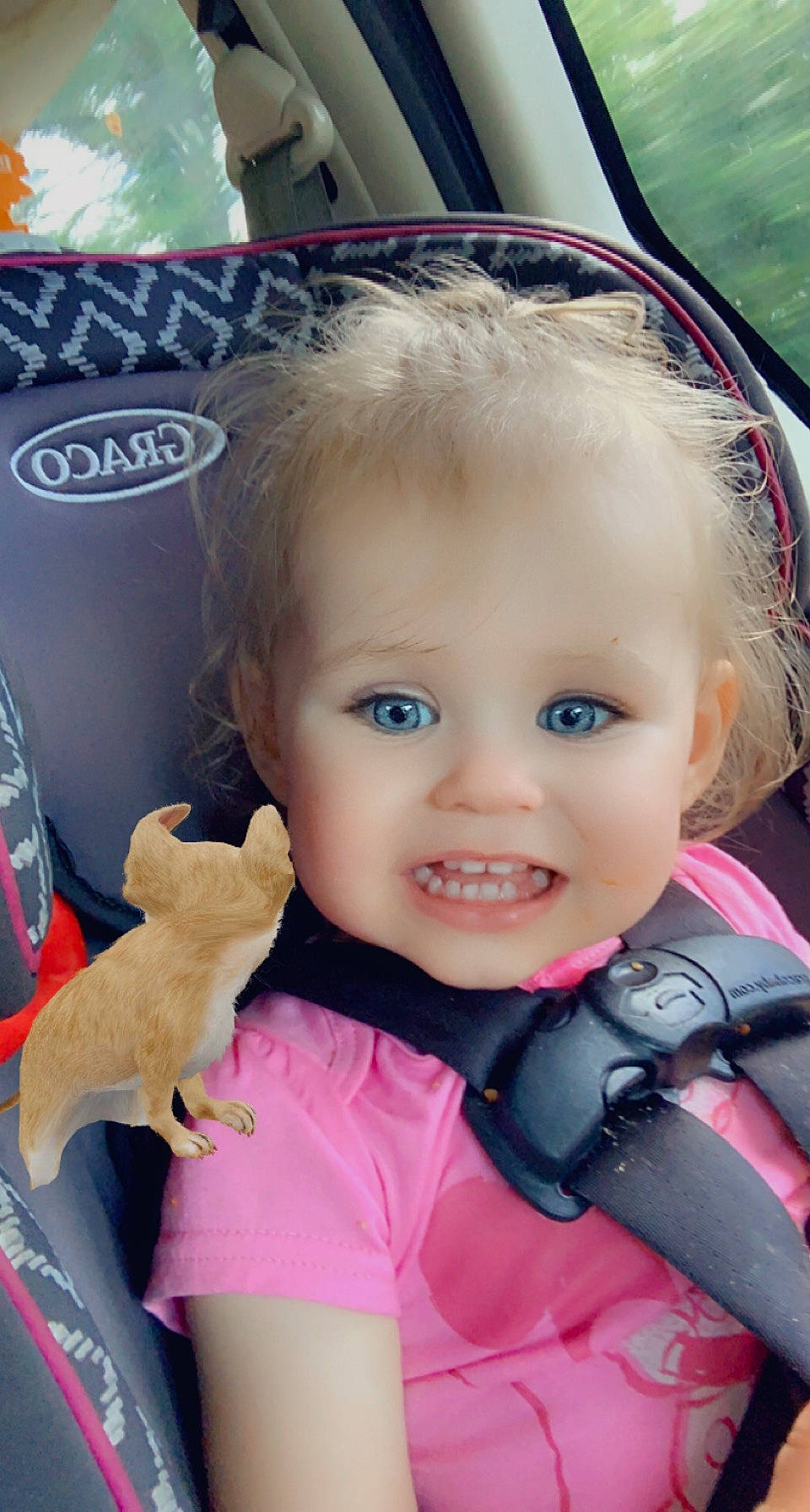Della is registered to the contest to win money with this photo: baby, baby_carriage, baby_products, blond, cheek, child, electric_blue, eye, eyelash, face, fashion_accessory, fun, gesture, happy, person, personal_protective_equipment, pink, product, skin, smile