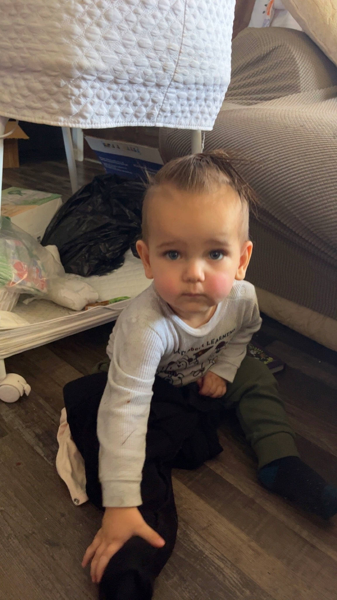 Corey is registered to the contest to win money with this photo: baby, baby_toddler_clothing, cheek, child, comfort, eye, face, flash_photography, floor, flooring, happy, hardwood, head, human_body, leg, person, sitting, skin, sleeve, toddler