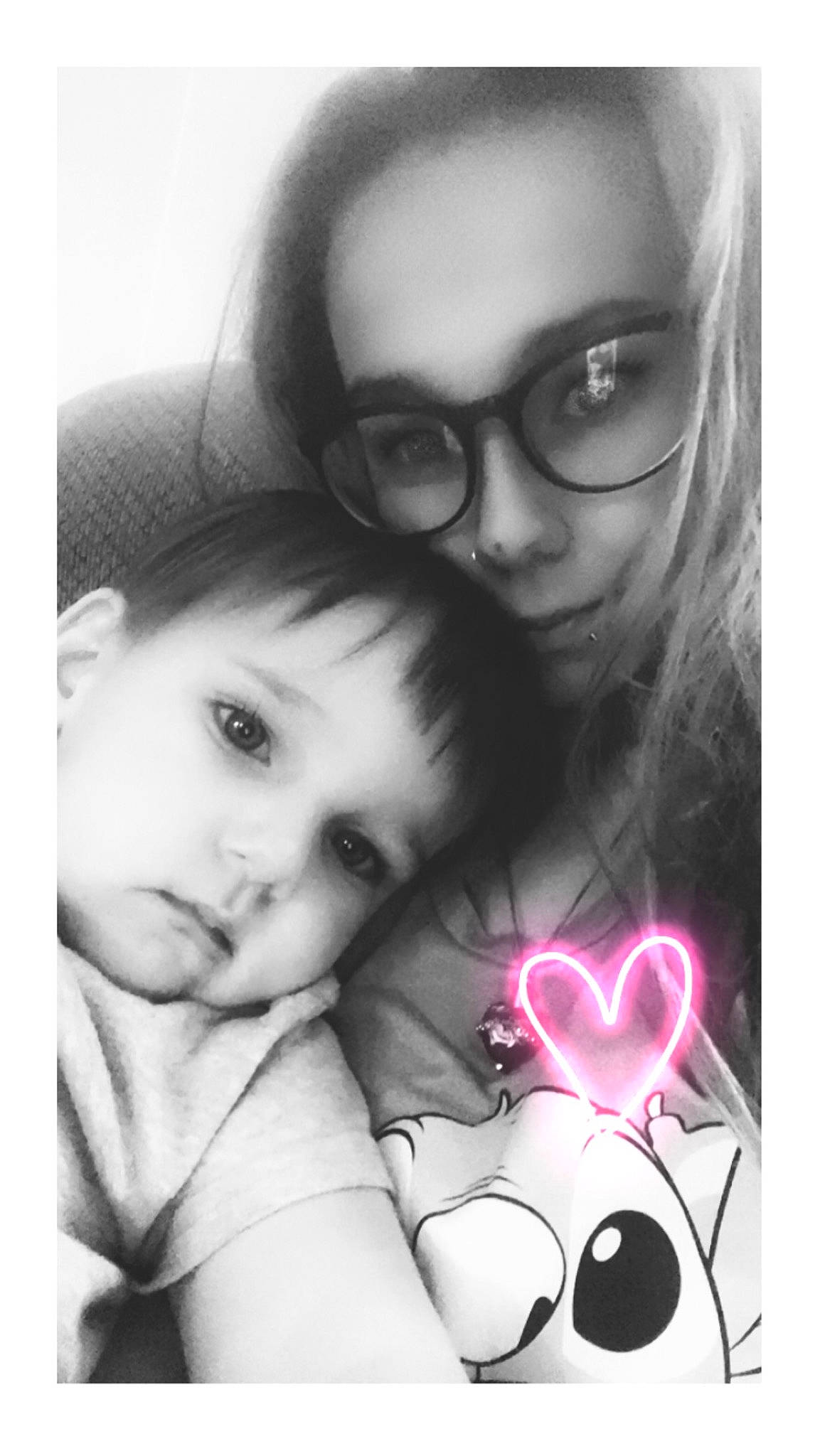 Corey is registered to the contest to win money with this photo: cheek, eye, eyebrow, eyelash, eyewear, face, facial_expression, gesture, glasses, happy, human, iris, lip, mouth, nose, organ, person, photograph, toddler, vision_care