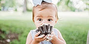 Marci is registered to the contest to win money with this photo: baby, child, grass, hand, happy, photograph, photographer, photography, portrait_photography, stock_photography, toddler