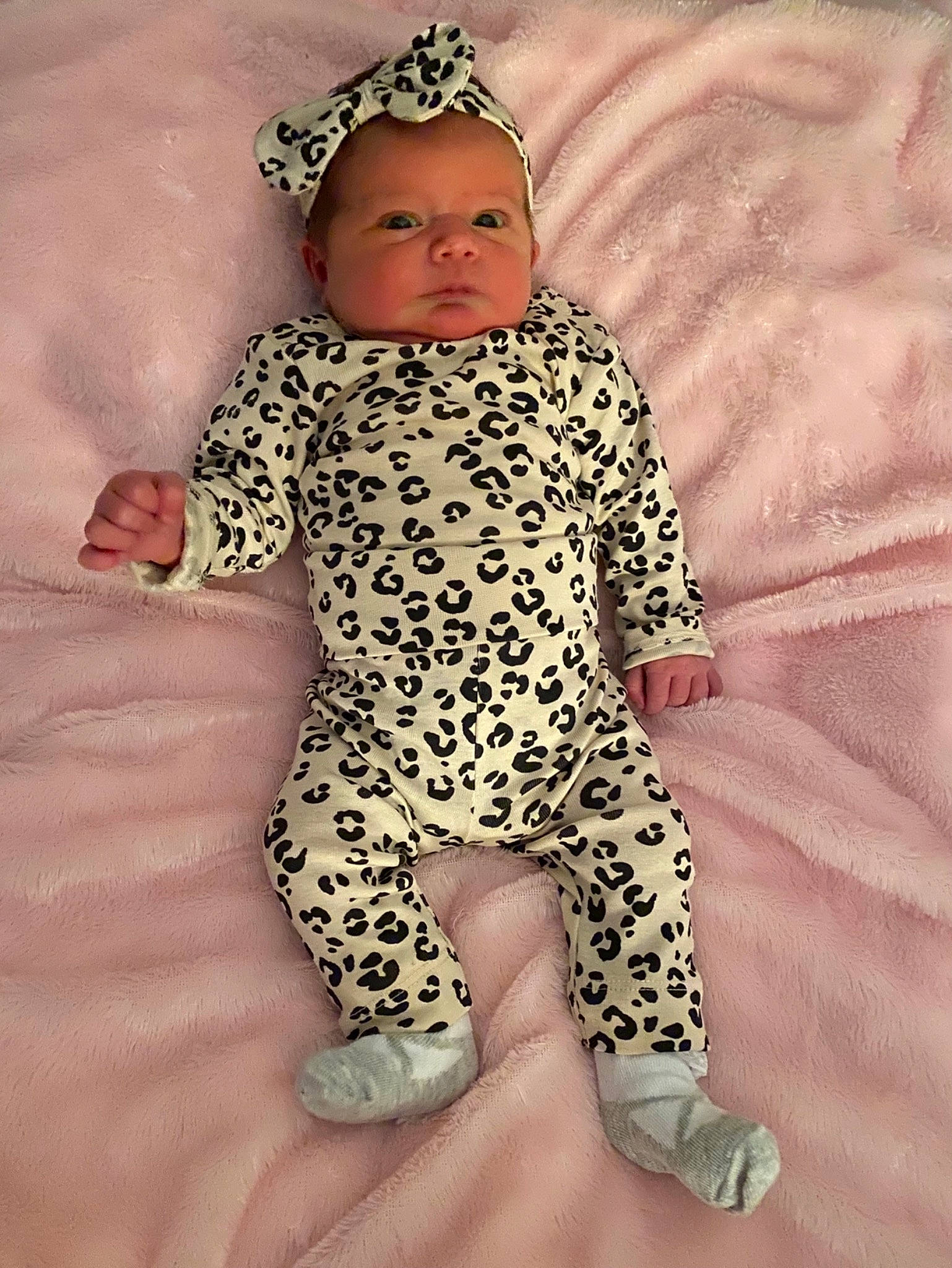 Lily-rose is registered to the contest to win money with this photo: arm, baby, baby_sleeping, baby_toddler_clothing, comfort, dress, face, finger, gesture, head, human_body, knee, neck, person, pink, skin, sleeve, textile, thigh, thumb