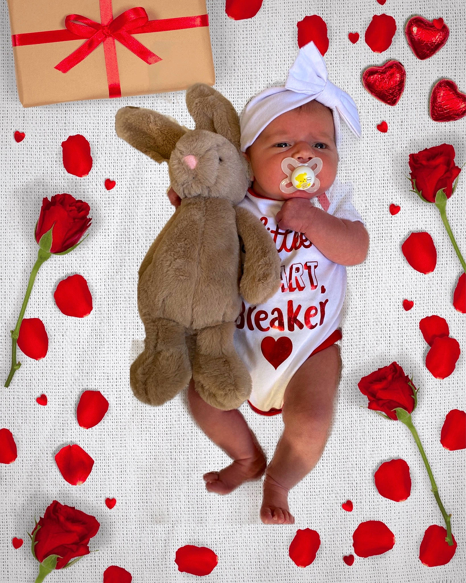 Lily-rose is registered to the contest to win money with this photo: baby, baby_products, baby_toddler_clothing, carmine, creative_arts, doll, event, fawn, fictional_character, hat, headwear, linens, pattern, person, product, rabbit, red, sleeve, stuffed_toy, textile