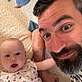 Jeanne a rejoint le concours — aidez-le/la à gagner de superbes lots ! baby, man, beard, smile, face, eyes, bed, pattern, clothing, toy, child, portrait, happy, indoor, person, cute, expression, striped_shirt, skin, head