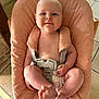 baby, infant, child, smiling, face, skin, arm, leg, foot, hand, seat, cushion, harness, fabric, floor, tile, indoor, person, comfort, home