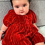Sidak joined the competition — help win amazing prizes! baby, child, red_dress, pigtails, hair_bows, sitting, carpet, couch, indoor, cute, portrait, infant, smiling, face, person, adorable, soft_lighting, black_hair, pink_skin, bracelet
