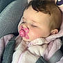 baby, infant, sleeping, pacifier, car_seat, hoodie, pink, curly_hair, cheek, closed_eyes, toy, teether, soft_texture, seat_harness, portrait, cute, nap, toddler, stuffed_animal, relaxed