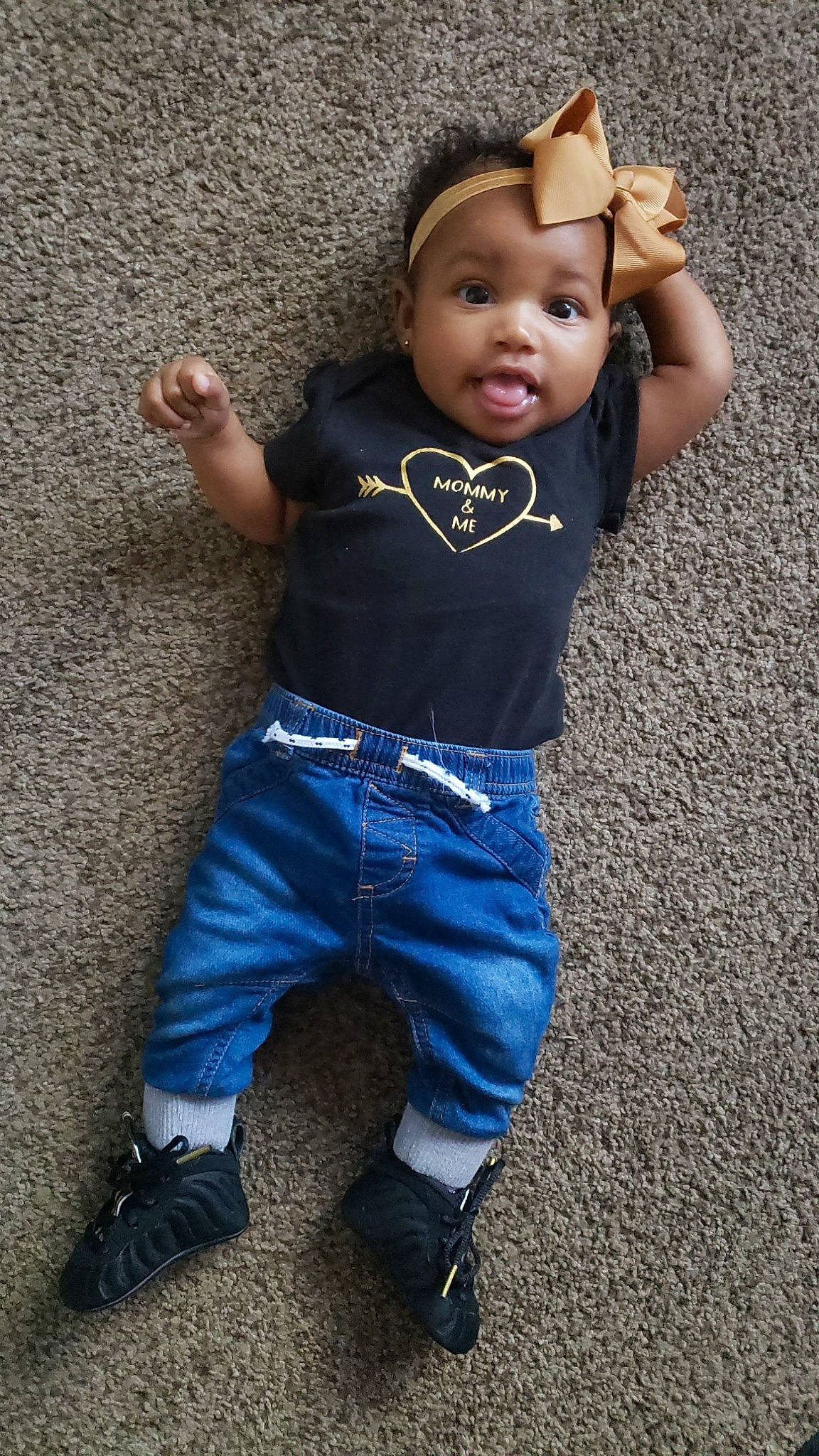 Kaziah is registered to the contest to win money with this photo: abdomen, baby, baby_products, baby_toddler_clothing, cheek, child, child_model, denim, finger, gesture, hand, overall, person, pocket, skin, sweatpant, thumb, toddler, trunk