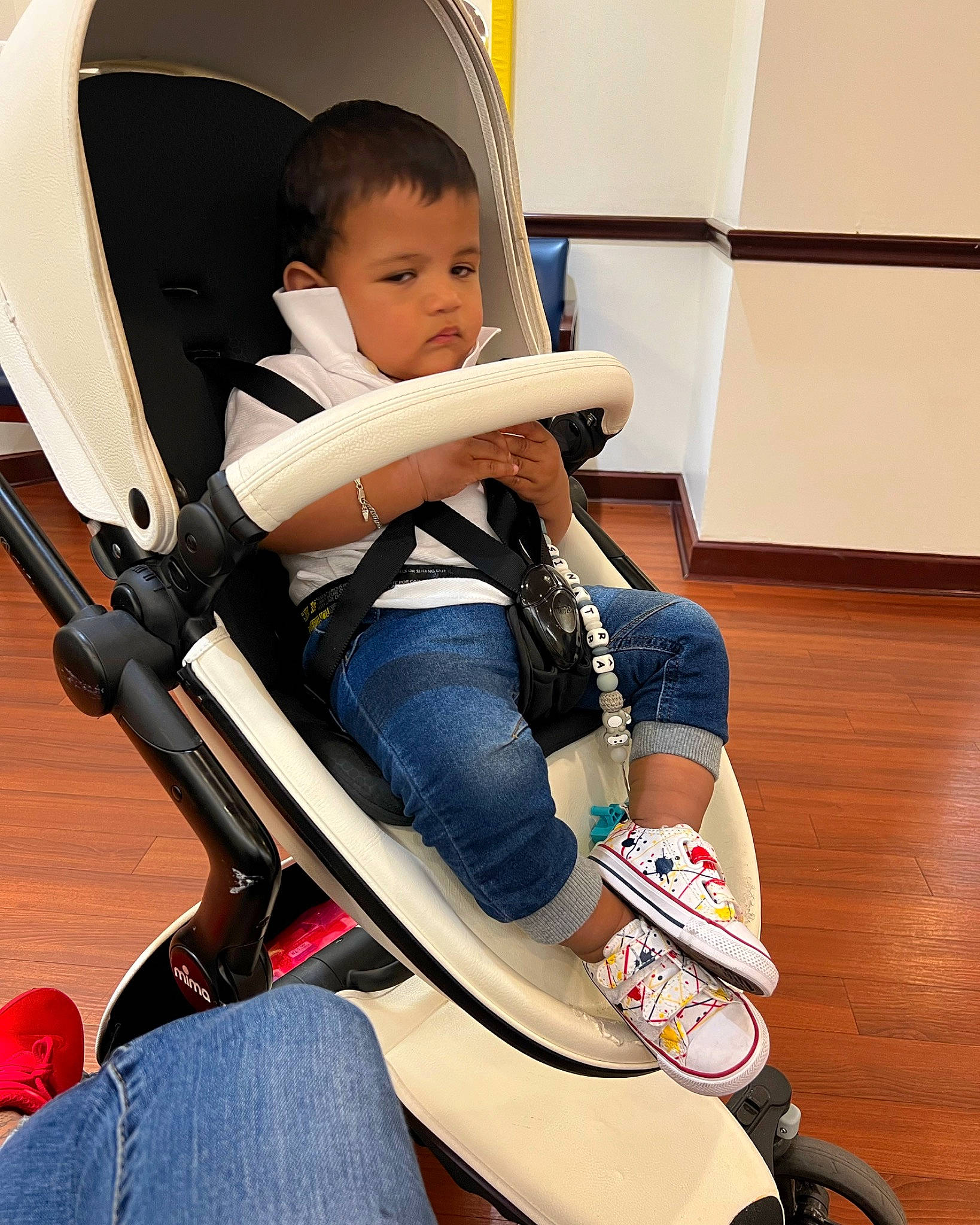 Sinatra joined the competition — help win amazing prizes! baby_products, child, comfort, electric_blue, fun, human_leg, jeans, knee, lap, leisure, person, recreation, rolling, sitting, thigh, tire, toddler, travel, wheel, white