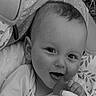 Louis participe au concours pour gagner de l'argent avec cette photo : baby, blanket, cheek, child, closeup, cute, face, grass, hand, happy, head, infant, monochrome, outdoor, pacifier, pattern, playful, portrait, smile, young