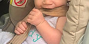 Nathan joined the competition — help win amazing prizes! baby, blue_eyes, car, car_seat, chewing, child, closeup, clothing, curly_hair, cute, face, hands, indoor, infant, playful, safety_strap, seatbelt, smile, toddler, young_child