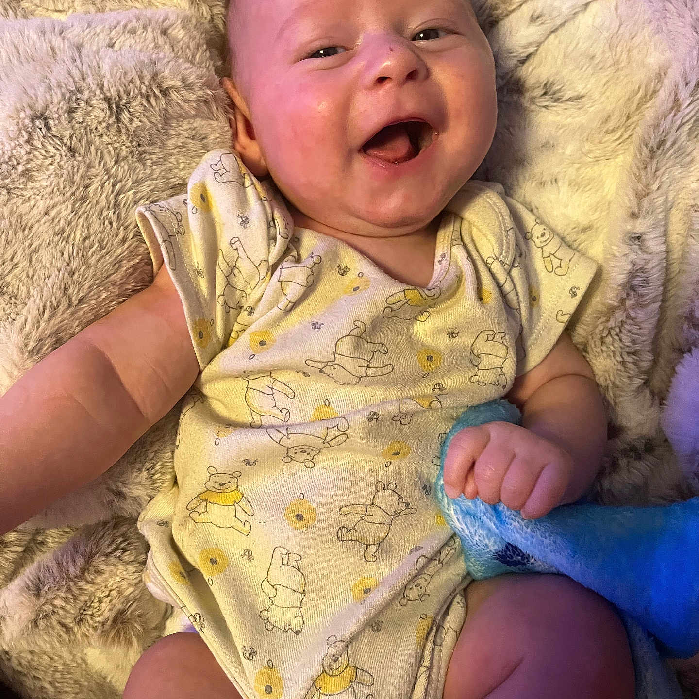 Dominick joined the competition — help win amazing prizes! baby, babylaughing, blanket, bodypart, clothing, face, finger, glove, hand, happy, head, laughing, newborn, person, photography, portrait, quilt, sitting, smile, towel