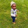 Marlon is registered to the contest to win money with this photo: child, toddler, outdoors, grass, lawn, standing, walking, portrait, beanie, hat, vest, plaid, shirt, pants, boots, fashion, smiling, playful, park, daylight