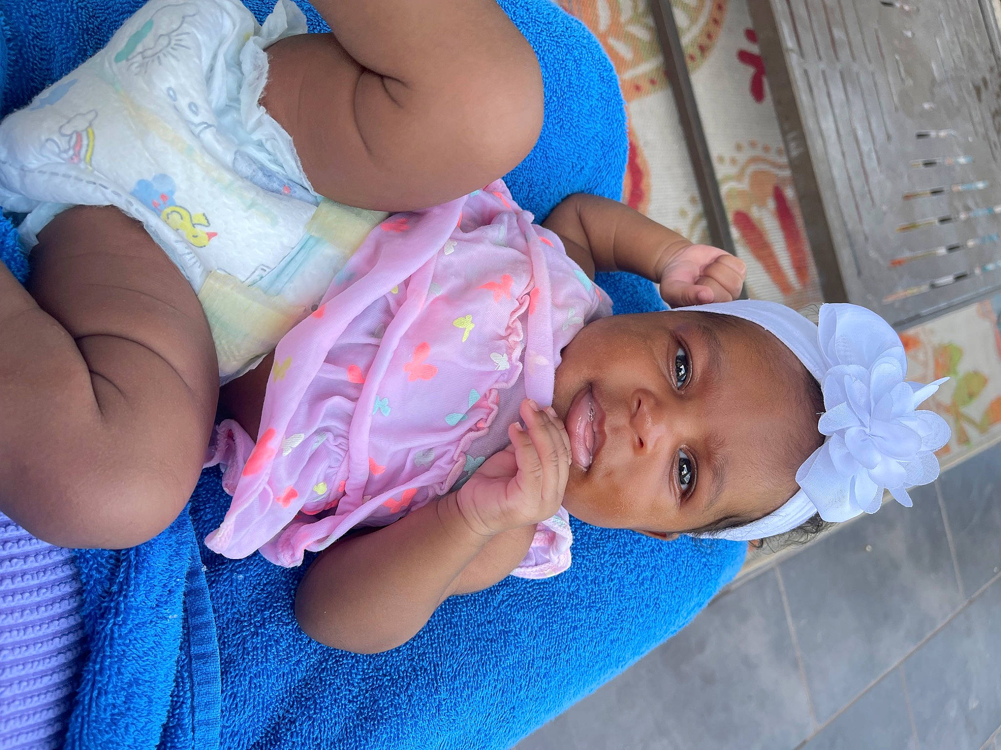 Aubrie is registered to the contest to win money with this photo: abdomen, arm, baby, baby_toddler_clothing, blue, chest, child, fun, happy, hat, headwear, human_leg, mouth, organ, person, product, skin, smile, stomach, thigh