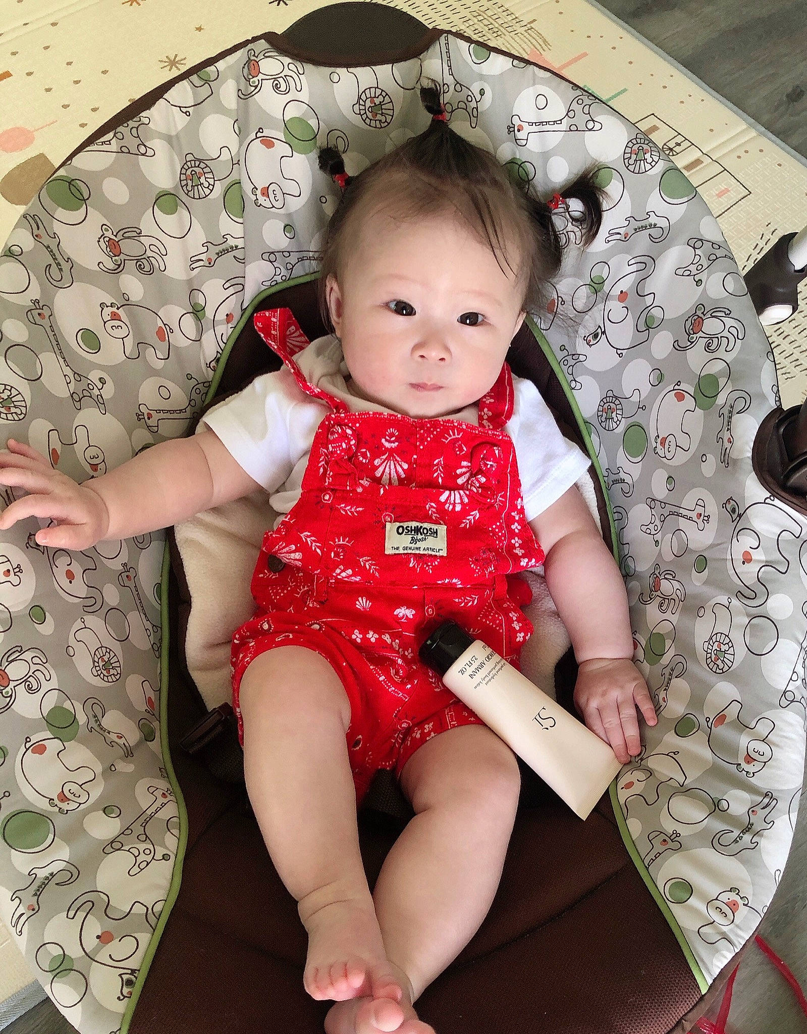 Joyce is registered to the contest to win money with this photo: arm, baby, baby_toddler_clothing, chair, cheek, child, day_dress, dress, facial_expression, hairstyle, happy, head, pattern, person, pink, product, skin, sleeve, sock, thigh