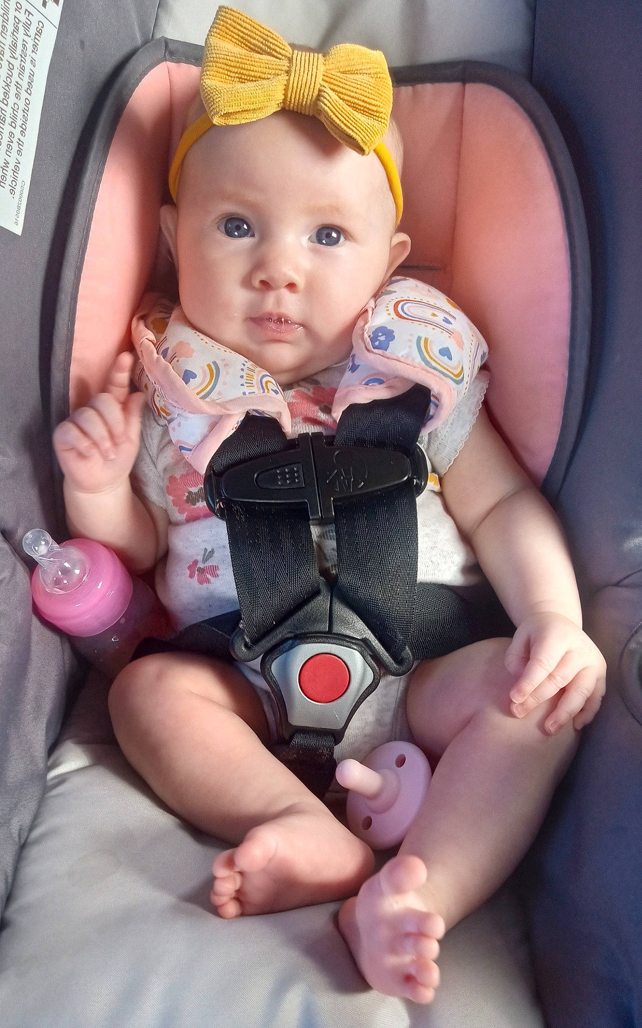 Malia is registered to the contest to win money with this photo: baby, baby_carriage, baby_in_car_seat, baby_toddler_clothing, cheek, comfort, eye, face, finger, gesture, hand, head, nail, people, person, pink, product, skin, thigh, thumb