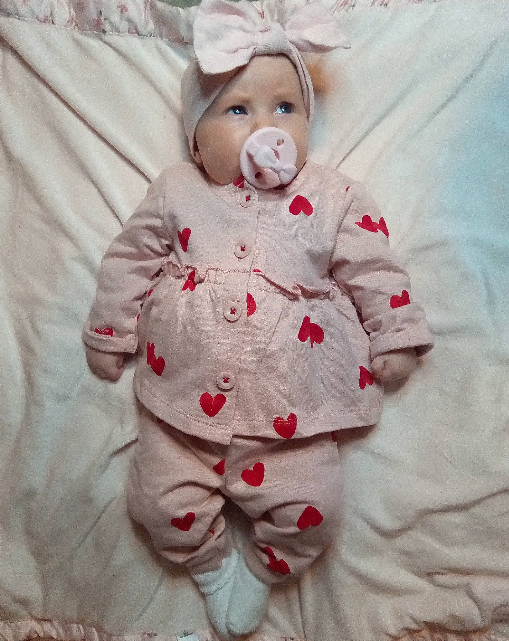 Malia is registered to the contest to win money with this photo: baby, baby_products, baby_sleeping, baby_toddler_clothing, bedding, carmine, child, comfort, fur, happy, linens, pattern, peach, person, pink, room, sleeve, textile, toddler