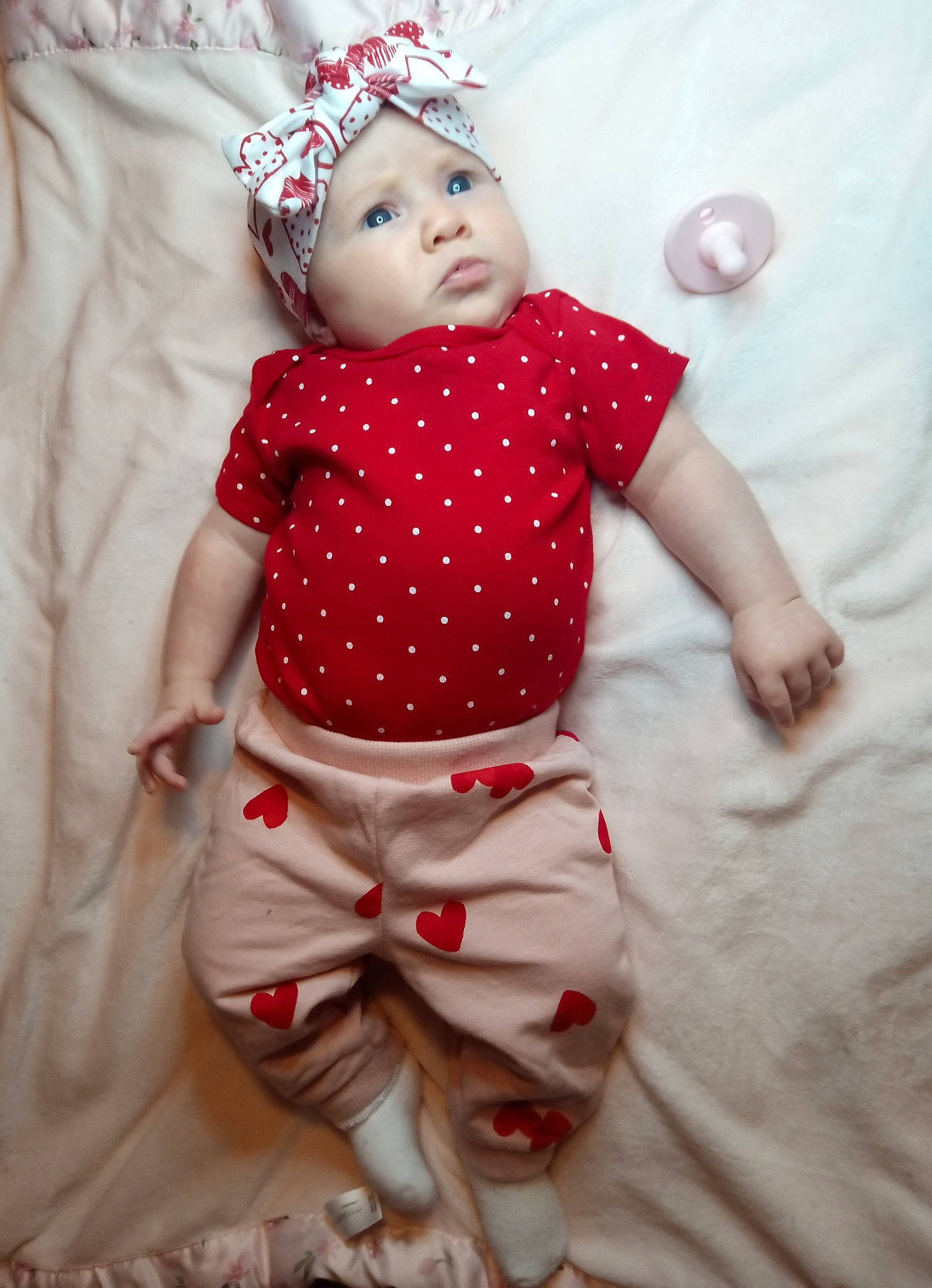 Malia joined the competition — help win amazing prizes! baby, baby_products, baby_toddler_clothing, child, doll, dress, eye, face, head, headwear, human_body, linens, one_piece_garment, pattern, person, pink, skin, sleeve, textile, toddler