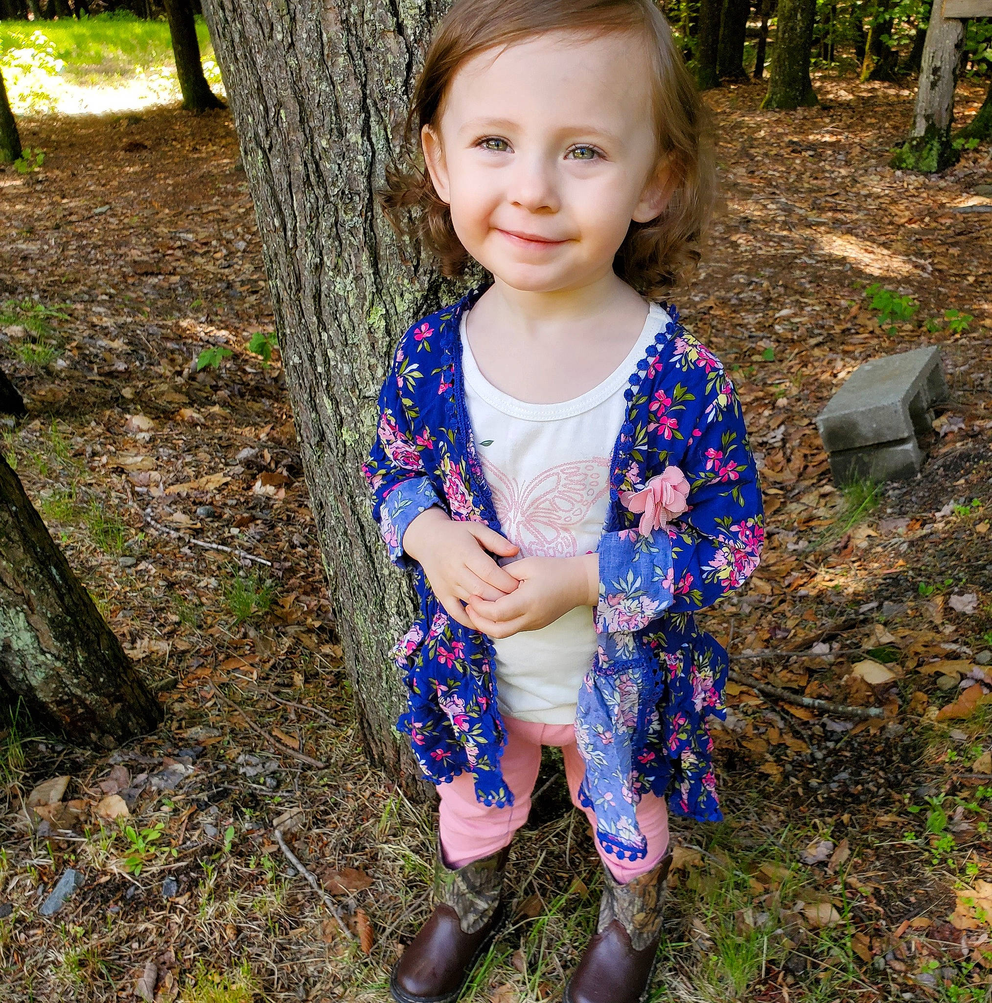 Annabelle is registered to the contest to win money with this photo: blue, child, design, dress, eye, face, grass, green, head, joy, leaf, outerwear, pattern, people, person, plant, smile, spring, summer, toddler
