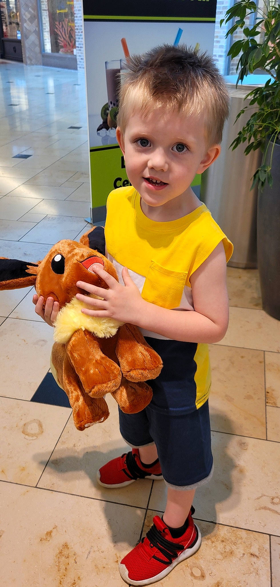 Dillon is registered to the contest to win money with this photo: baby, baby_toddler_clothing, child, costume, flooring, flowerpot, fun, fur, happy, leisure, mascot, person, play, plush, shorts, sitting, stuffed_toy, thumb, toddler, toy