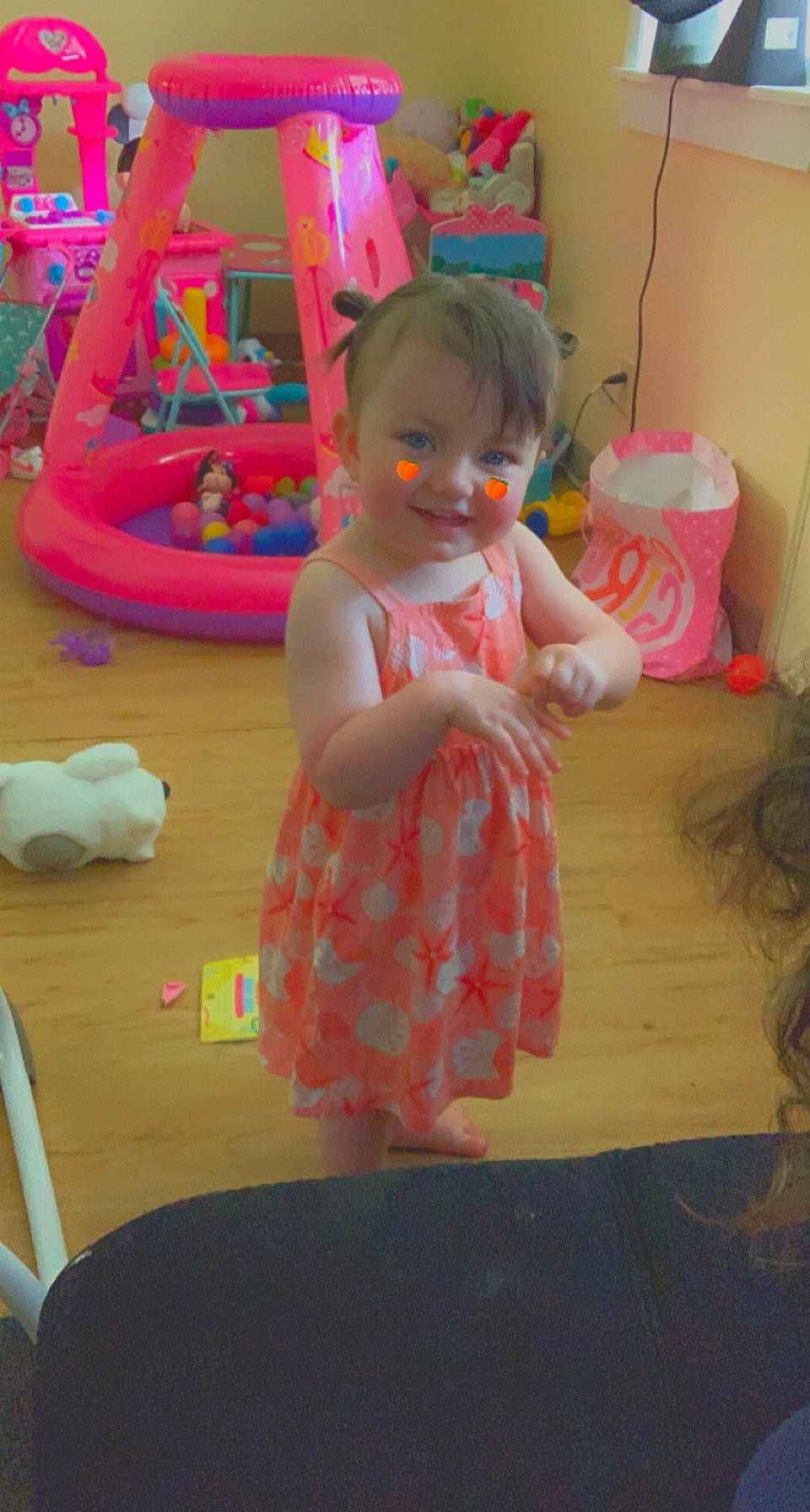 Lillyanna is registered to the contest to win money with this photo: baby, baby_products, baby_toddler_clothing, baby_toys, carton, child, flooring, fun, joy, leisure, magenta, pattern, person, pink, play, recreation, room, shipping_box, sitting, smile