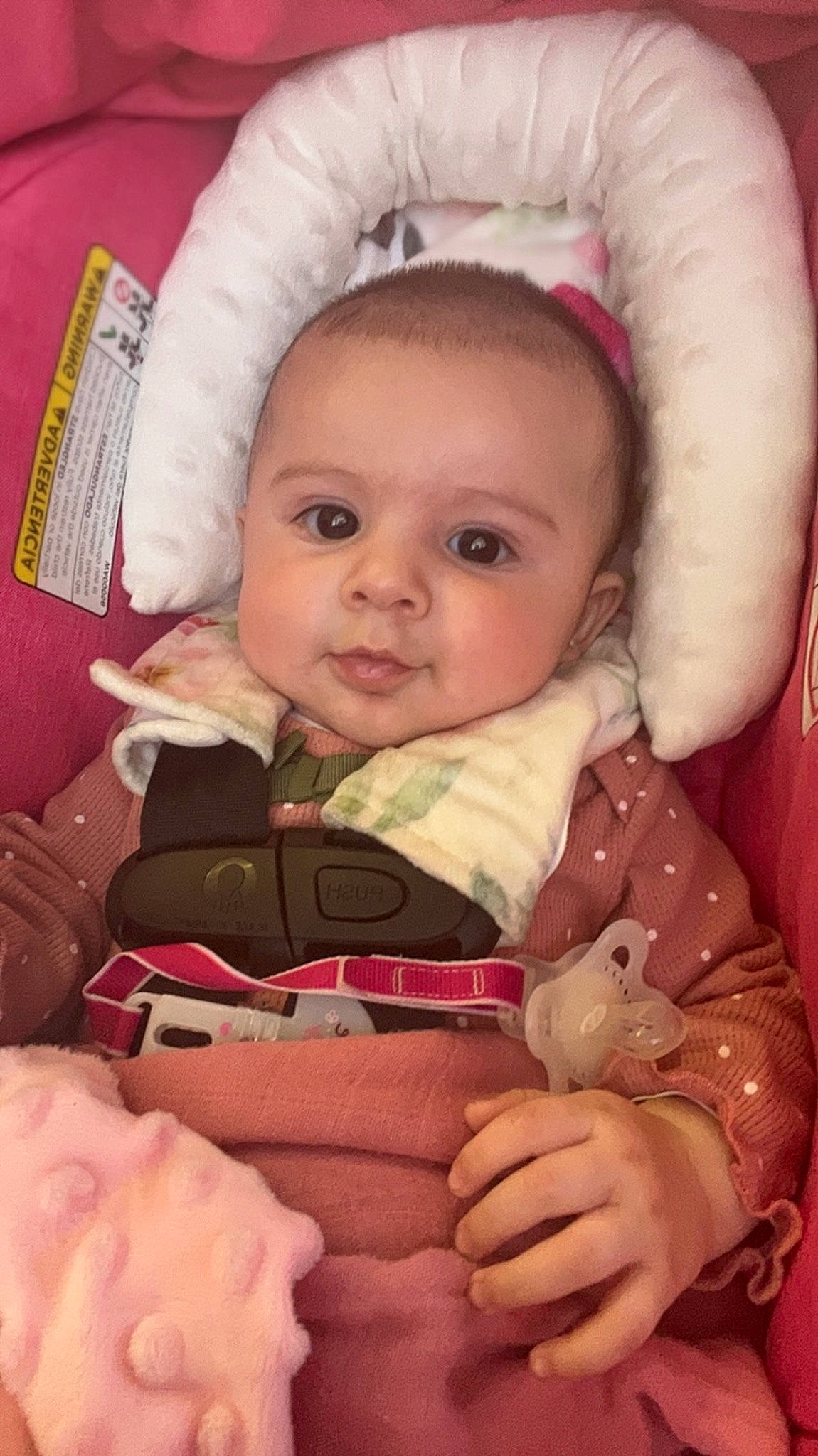 Leilani is registered to the contest to win money with this photo: baby, baby_toddler_clothing, cheek, chin, comfort, eye, eyelash, face, finger, head, iris, lip, mouth, nose, organ, person, pink, product, skin, textile