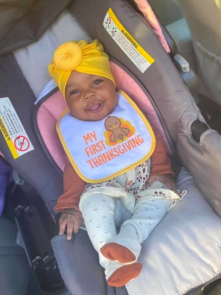 Carlee joined the competition — help win amazing prizes! baby, baby_in_car_seat, baby_products, baby_safety, baby_toddler_clothing, car_seat, child, comfort, headwear, lap, orange, person, thumb, toddler