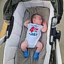 Paxton joined the competition — help win amazing prizes! baby, stroller, sleeping, onesie, blue_socks, blanket, outdoor, footwear, infant, child, person, fabric, foot, pavement, wheel, clothing, resting, cute, celebration, summer