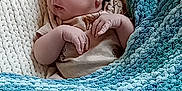 Paxton is registered to the contest to win money with this photo: baby, blanket, blue, child, comfort, cozy, cream, cute, indoors, infant, knit_blanket, newborn, peaceful, portrait, resting, sleeping, small_hands, soft_texture, teal, wrapped